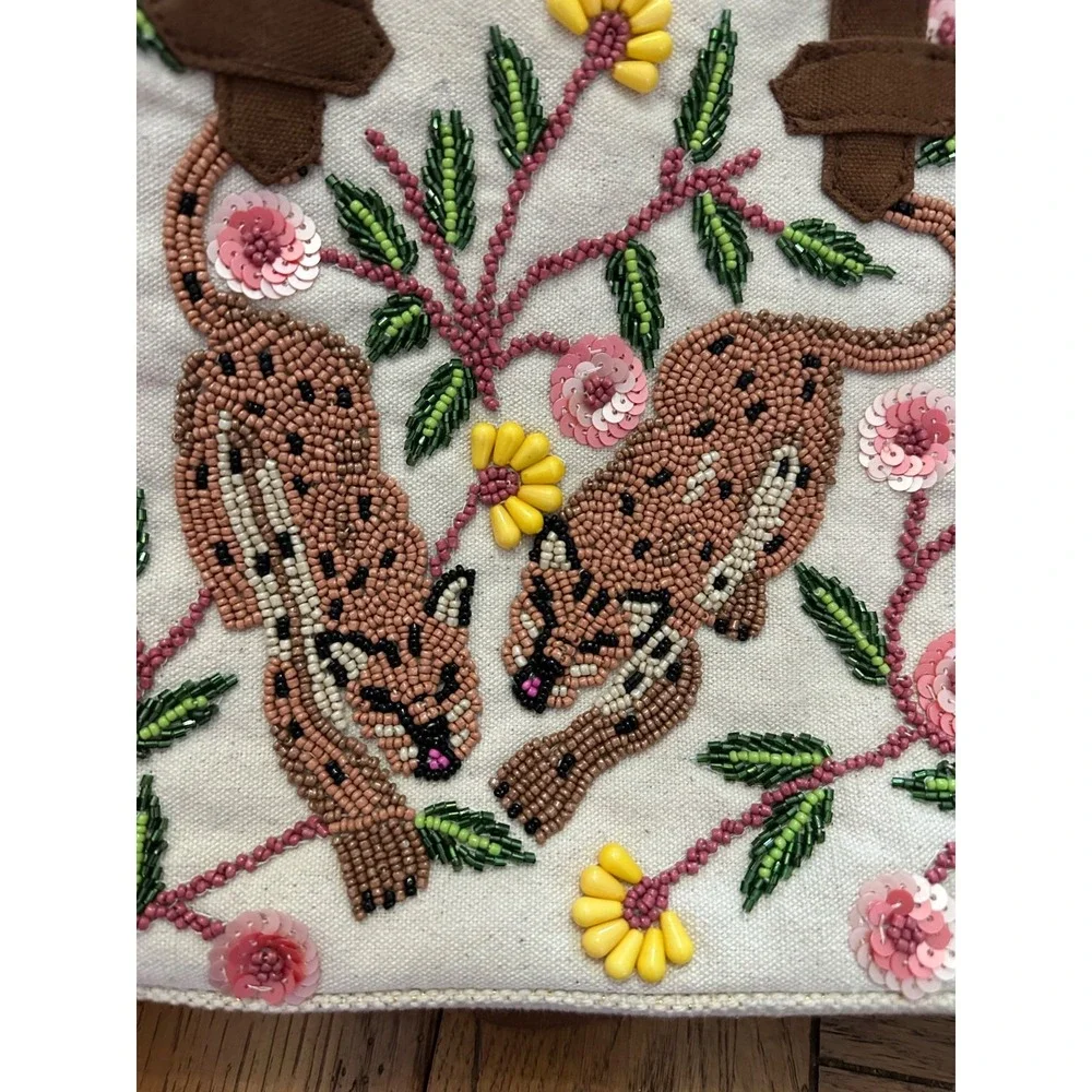 America and beyond cream‎ fringed purse with beaded animals and palm tree